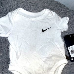Newborn Nike button shirt brand new still has tag on it.